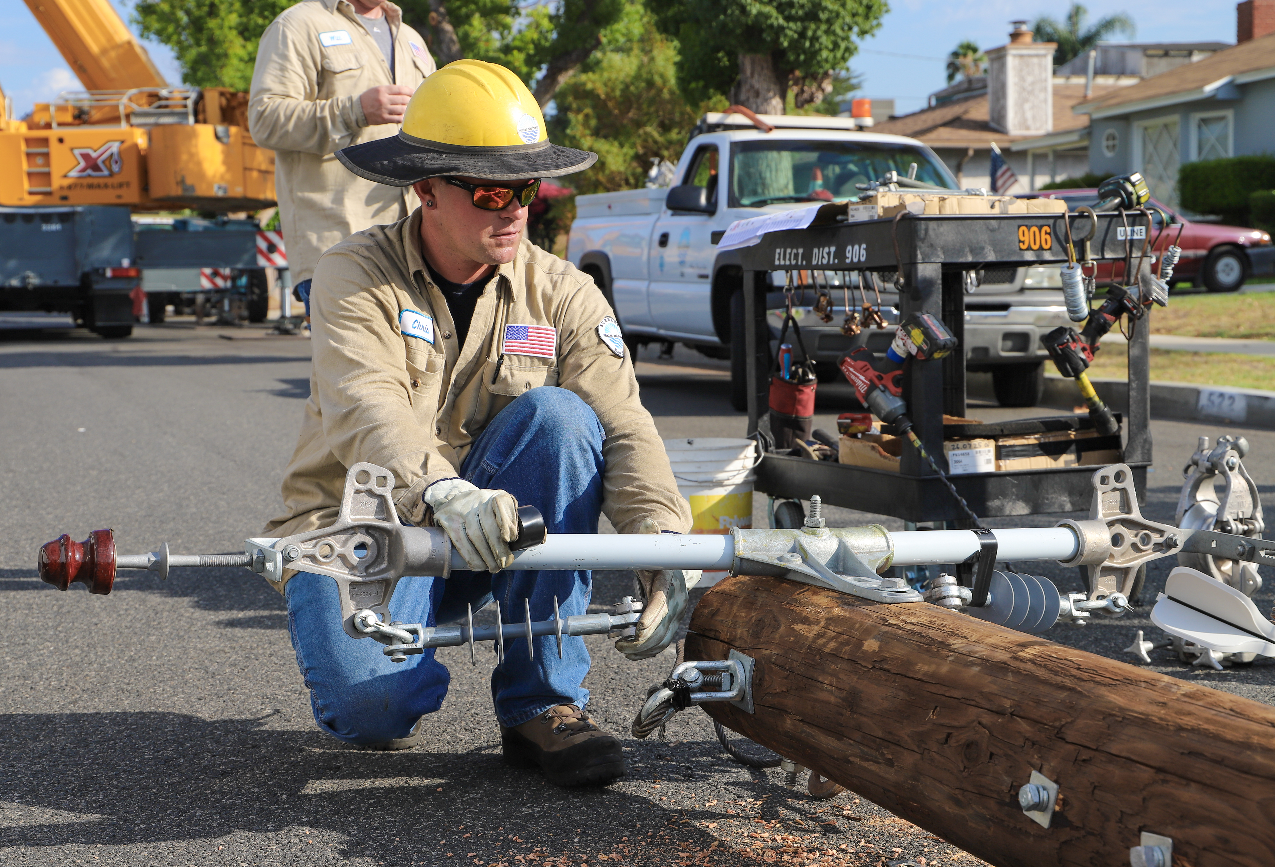 Electrician working on modernizing the power grid by working on a power line