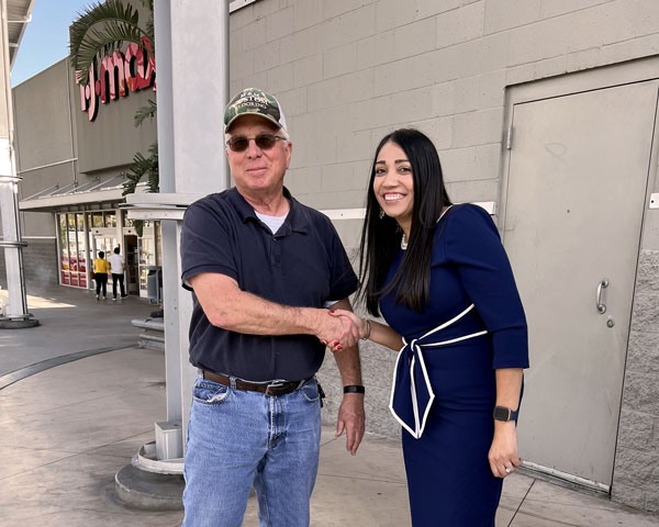 Mandip speaking to locals at the Empire Center