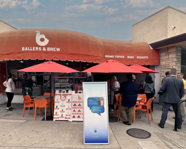 Mandip at Ballers & Brew with GM Sessions sign