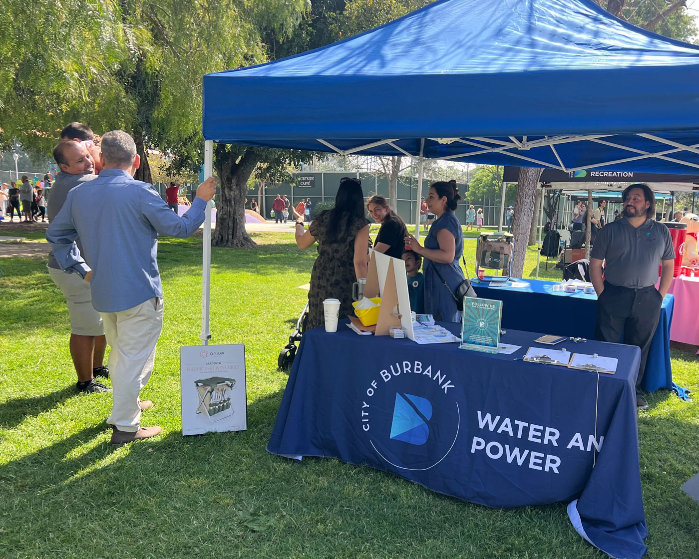 Mandip meeting people at McCambridge Park for a morning filled with egg hunts, laughter, and bunny-ear cuteness.