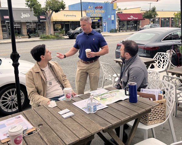 BWP employee meeting with locals at the Palm Coffee Bar